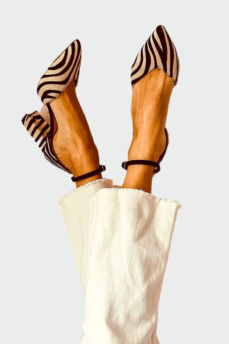 Stylish stiletto heels with pointed toe in zebra stripe design and strap