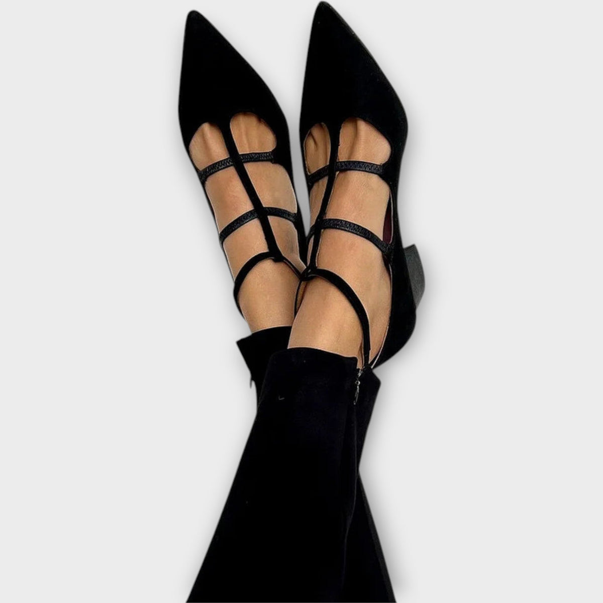 Pointed toe shoes with crossed straps