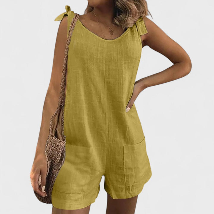 Short jumpsuit with shoulder pockets and ties