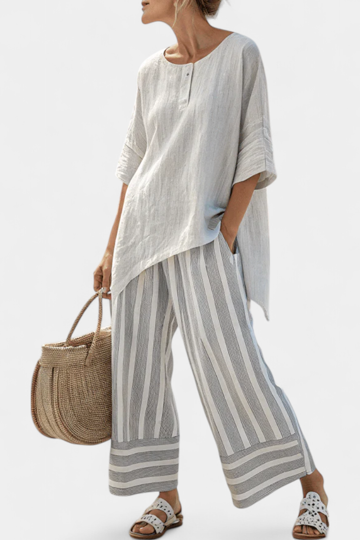 Daisy Set with Asymmetric Blouse and Striped Pants for a Modern and Elegant Style