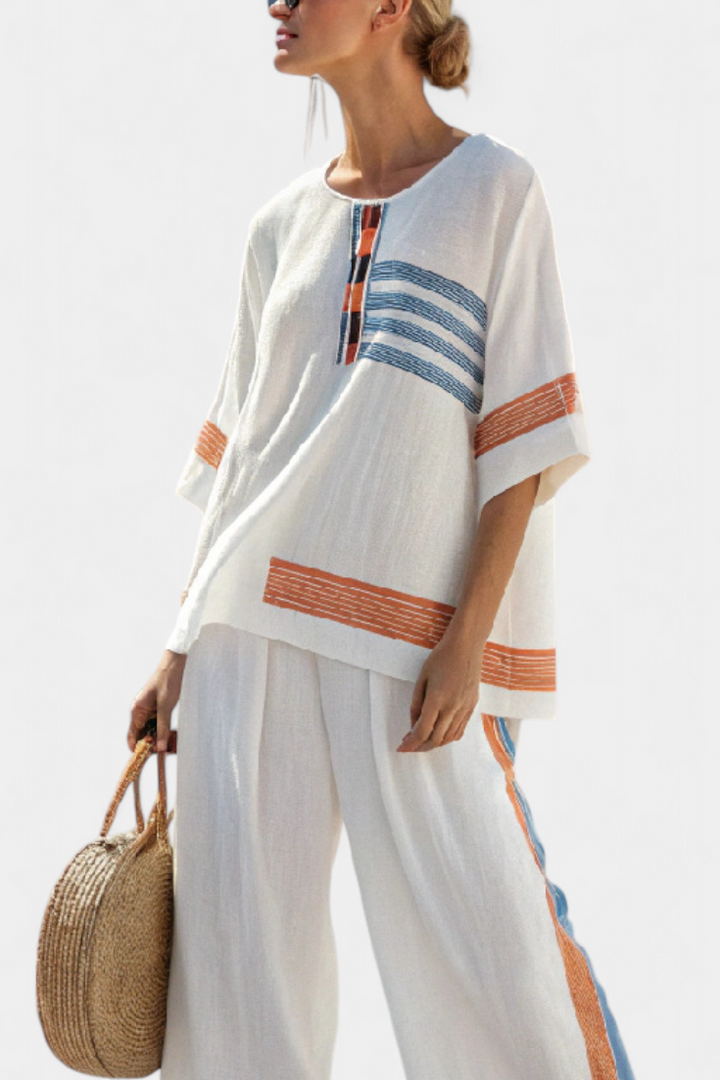 Daisy set in white with details in blue and orange – unique and vibrant design
