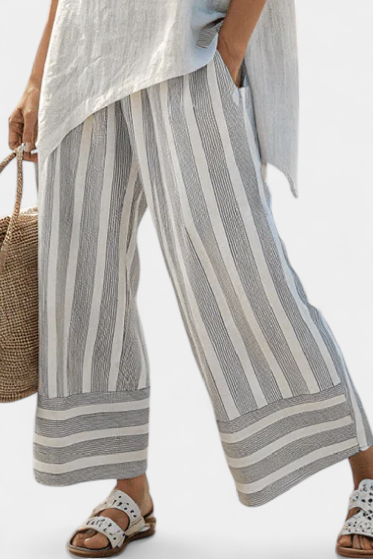 Daisy Set with Asymmetric Blouse and Striped Pants for a Modern and Elegant Style