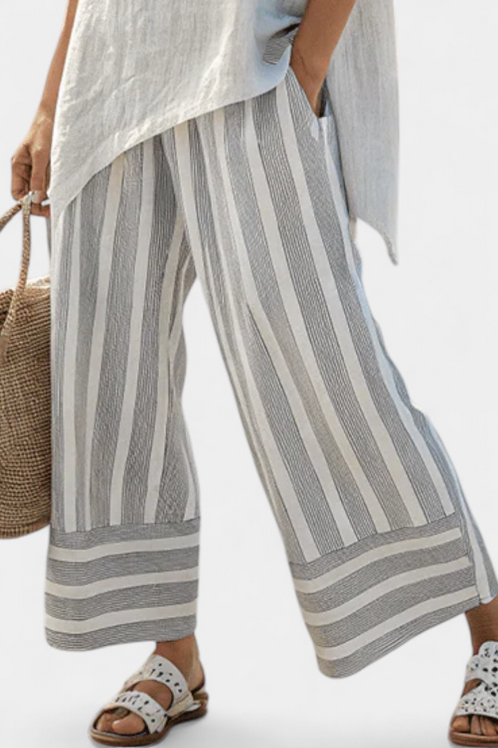 Daisy Set with Asymmetric Blouse and Striped Pants for a Modern and Elegant Style